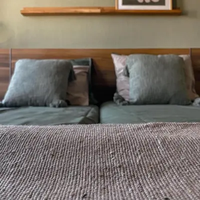 a bedroom with two pillows on top of a bed at B&B Mol in Katwijk aan Zee