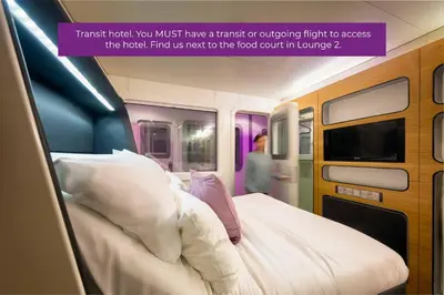 a poster of a train room with a bed at YOTELAIR Amsterdam Schiphol Transit Hotel in Schiphol