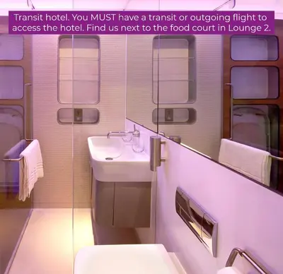 a bathroom with a sink and a toilet and a mirror at YOTELAIR Amsterdam Schiphol Transit Hotel in Schiphol