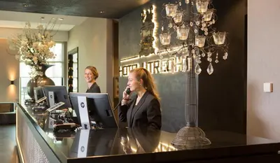 two women standing at a counter in a salon at Van der Valk Hotel Utrecht in Utrecht