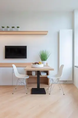 a dining room with a table and two chairs at 2L Hof van Holland apartments in Noordwijk