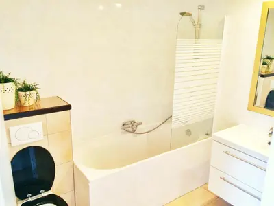 a bathroom with a toilet and a bath tub at Jordaan View in Amsterdam