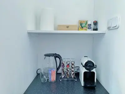 a kitchen counter with a coffee maker and a blender at Jordaan View in Amsterdam