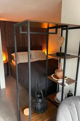 a room with a bunk bed and a room with at Studio@25 in Zandvoort