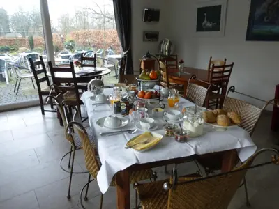 a table with plates of food on top of it at de zanderij in 's-Graveland