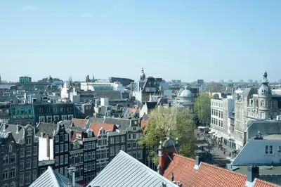 a view of a city with buildings and roofs at Residence Flower Market in Amsterdam