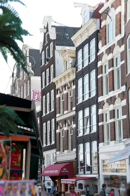 a group of tall buildings on a city street at Top Of The City in Amsterdam