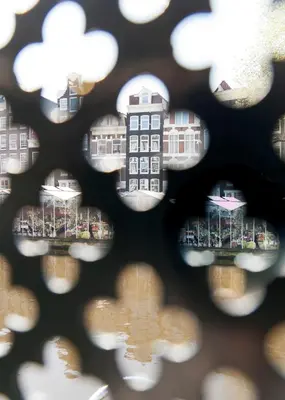 a view of a city through a window at Top Of The City in Amsterdam
