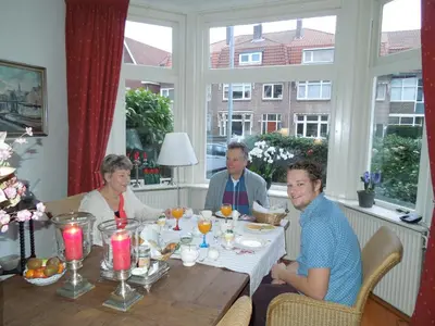 a group of people sitting around a table at Bed & Breakfast Frans Hals Haarlem in Haarlem