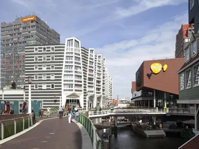 a view of a city with buildings and a bridge at easyHotel Amsterdam Zaandam in Zaandam