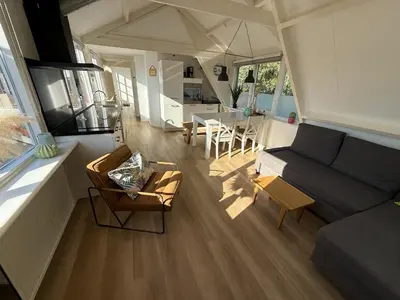 an aerial view of a living room and dining room at BeachVibes in Egmond aan Zee