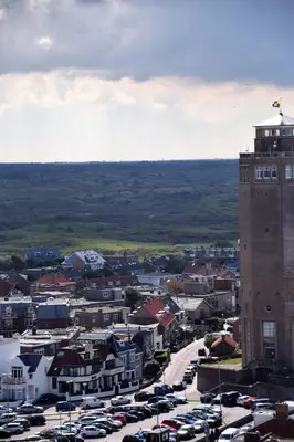a city with cars parked in a parking lot at Appartement Lefferts in Zandvoort