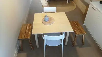 a small table with two chairs and a vase on it at Terrace Apartment Cyclades Free Parking in Amsterdam
