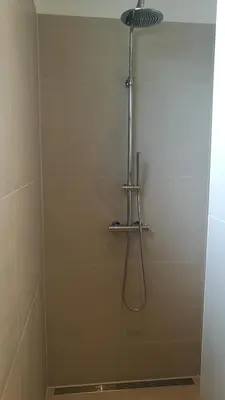 a shower stall with a shower head in a bathroom at Terrace Apartment Cyclades Free Parking in Amsterdam