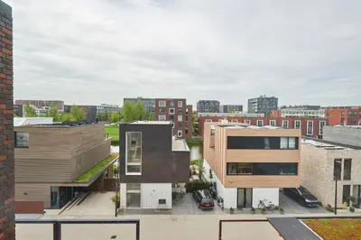an aerial view of a city with buildings at Lake View Apartment Amsterdam in Amsterdam