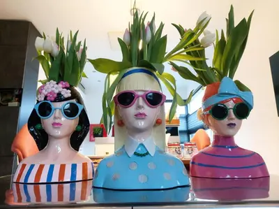 three plastic dolls wearing sunglasses on a table at Paradise Amsterdam bungalow of 80 m2 with private pool - inclusive, parking, use of bikes, tourist tax and much more in Zandvoort