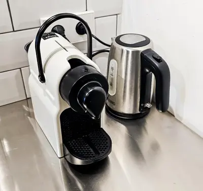 a coffee maker sitting on top of a kitchen counter at JoyJoyJoy the White Wilde ecolicious studio in a historic Canalhouse from 1799 with terrace at the canals in Amsterdam