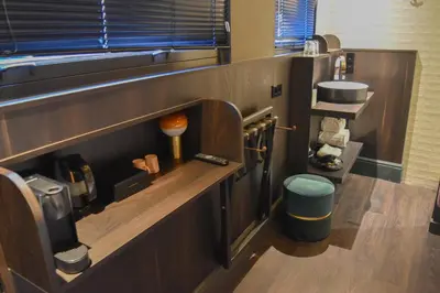 a bathroom with a counter with a sink and a toilet at Hotel Frank since 1666 in Amsterdam