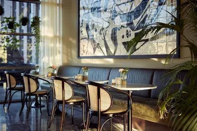 a row of tables and chairs in a restaurant at Van der Valk Hotel Amersfoort-A1 in Amersfoort