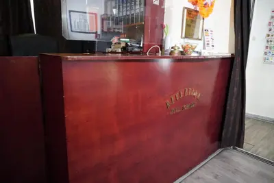 a wooden bar with the name of a restaurant at Hotel Schroder in Amsterdam