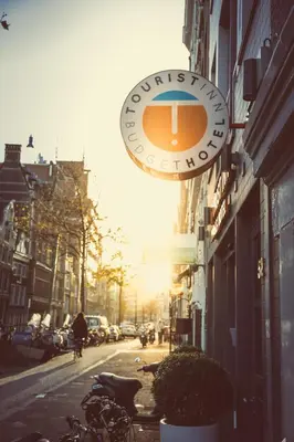 a sign for a coffee shop on a city street at Tourist Inn One Amsterdam in Amsterdam