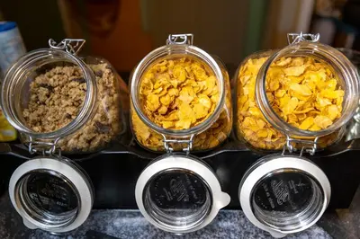 three trays of food sitting on top of a counter at Tourist Inn One Amsterdam in Amsterdam