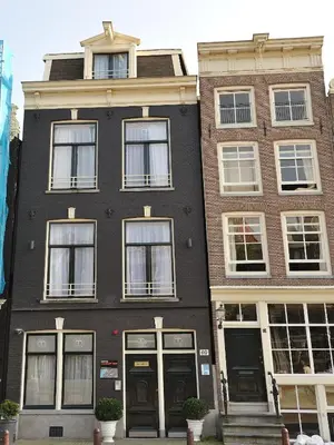 a black building with white windows and doors at Tourist Inn One Amsterdam in Amsterdam