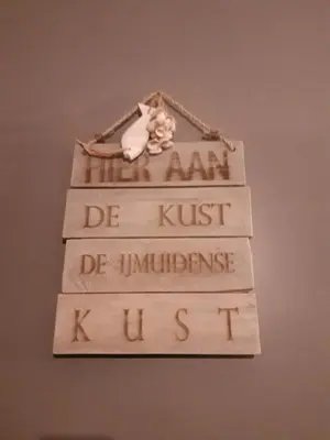 a group of wooden signs with the words be amazon be mush be intolerance istg at Hotel Velsen in IJmuiden