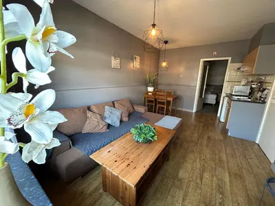 a living room with a couch and a table at Hotel Velsen in IJmuiden