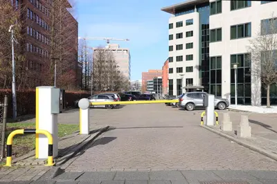 a parking lot with a yellow ribbon in a city at Hotel Levell in Amsterdam