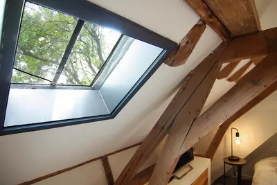a skylight in the attic of a house at Authentic Farmhouse - De Vergulden Eenhoorn in Amsterdam