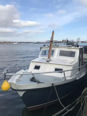 a boat docked at a dock in the water at City Sailing in Amsterdam