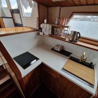 an overhead view of a kitchen in a boat at City Sailing in Amsterdam