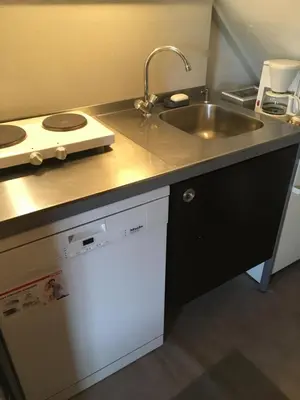 a kitchen with a sink and a counter top at Wim's Place Schiphol Amsterdam Airport in Hoofddorp