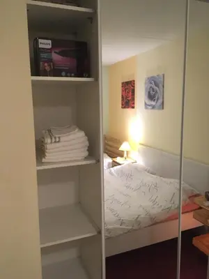 a bedroom with a closet with a bed in it at Wim's Place Schiphol Amsterdam Airport in Hoofddorp