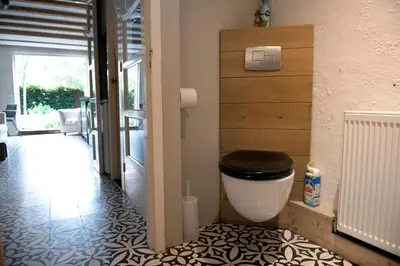 a bathroom with a toilet in a room at Family House Amsterdam in Amsterdam