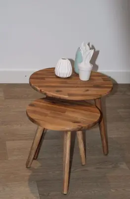 a wooden table with a stool and a table with yarn at Koningshof in Alkmaar