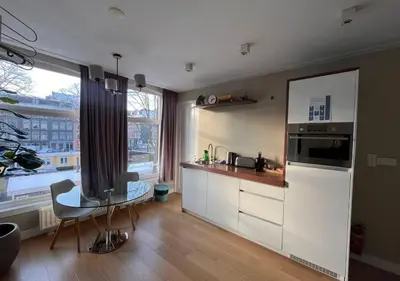 a kitchen with a sink and a counter top at Da Costa Suite in Amsterdam