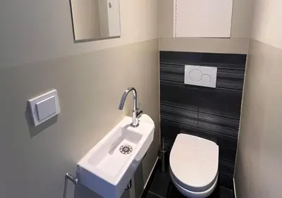 a bathroom with a sink and a toilet at Da Costa Suite in Amsterdam