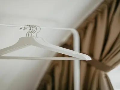a white hanger in a room with a curtain at Apartment in Egmond with Stunning Sea Views in Egmond aan Zee