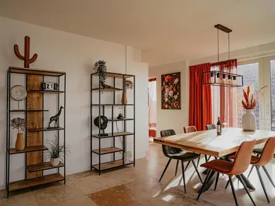 a dining room with a table and chairs at Apartment by the Beach with Sea Views in Egmond aan Zee