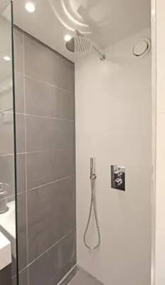 a shower with a glass door and a ceiling at Guesthouse Prinsencanal 1 in Amsterdam