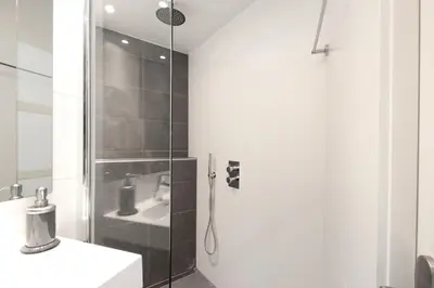 a bathroom with a shower and a sink at Guesthouse Prinsencanal 1 in Amsterdam