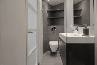a bathroom with a toilet and a sink at Guesthouse Prinsencanal 2 in Amsterdam