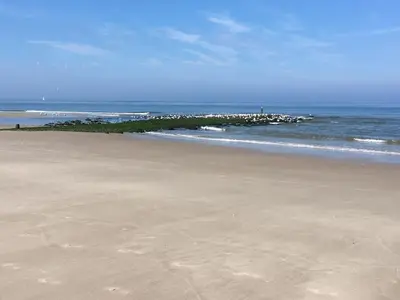 a sandy beach with the ocean in the background at Holiday Home Canal View in Alkmaar