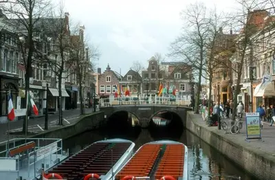 a group of boats in a canal in a city at Holiday Home Canal View in Alkmaar
