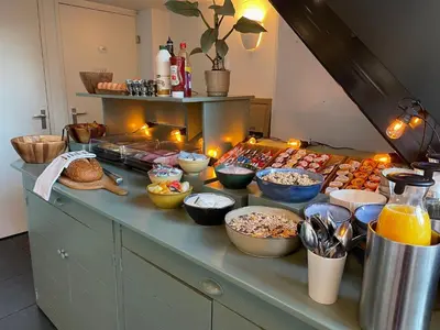 a buffet with many different types of food on a counter at Hotel de Gaaper in Amersfoort