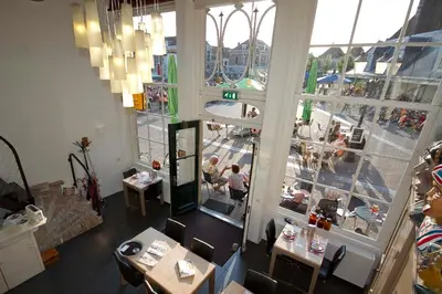 an overhead view of a restaurant with people sitting at tables at Hotel de Gaaper in Amersfoort