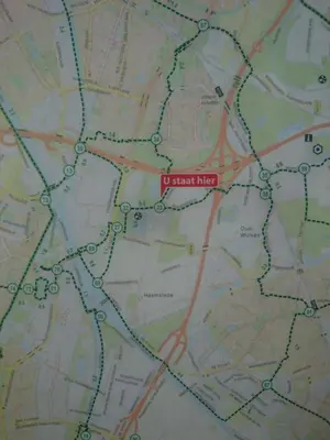 a map with a red marker on it at Guest House Ons Hoekje in Houten