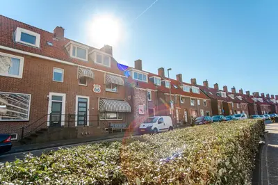 a row of brick houses on a city street at Pension Sixtysix in Zandvoort